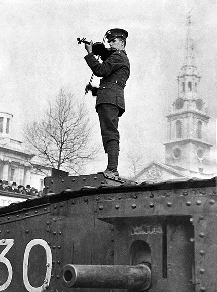 English violinist Albert Sammons plays atop a tank in Trafalgar Square, 1916